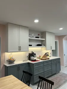 Two-tone sage and white cabinets with a coffee station and white quartz in Arlington, VA