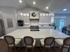 Kitchen Remodeling in Aldie, VA Jeff P. 4 Large quartz island with bar seating facing a statement range hood in an Aldie, VA kitchen