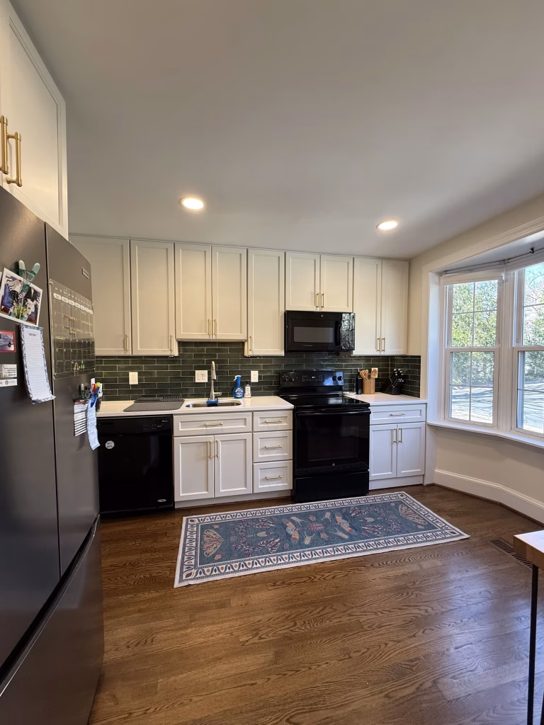 J&K Cabinetry Kitchen Remodeling with Green Backsplash in Annandale, VA | Erin H. Project 2 Newly remodeled kitchen featuring J&K Cabinetry and champagne bronze handles in Annandale, VA
