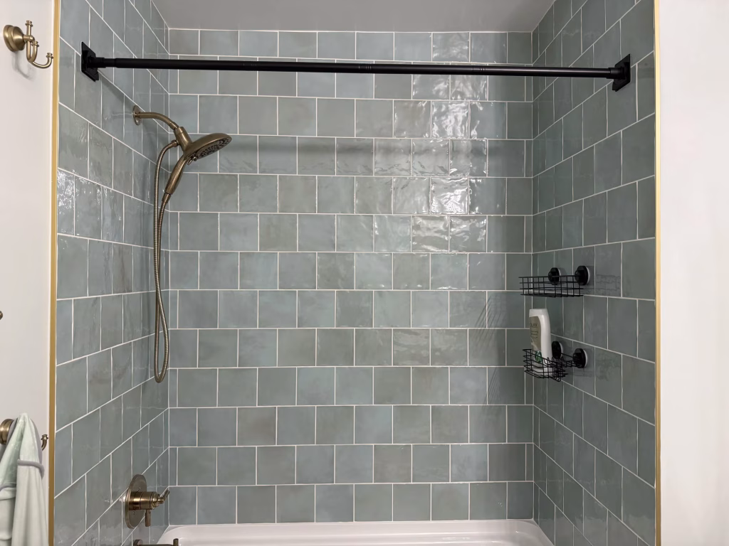 Modern Small Bathroom Remodeling with Green Tile in Arlington, VA | Pooja A. Project 26 Guest bathroom remodel in Arlington, VA with sage green square tile tub surround and brushed gold fixtures by Kitchen & Bath Masters